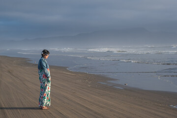 Beautiful Woman In Dress Enjoying The Coast