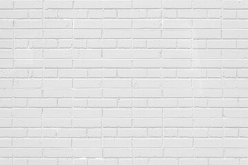White painted brick wall background, odd mixture of jack and running bond patterns, copy space, horizontal aspect