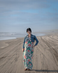 Smiling Woman In Dress Enjoying The Nice Weather at The Coast