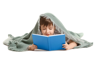 Little boy wrapped in plaid reading book on white background