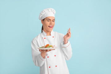 Transgender chef with salad on color background
