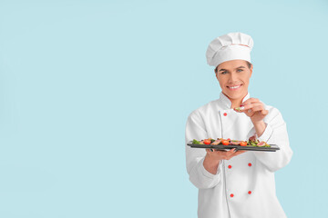 Transgender chef with salad on color background