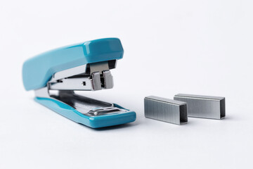 Blue stapler on a white background.