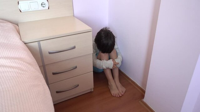 4K Punished boy sits in the corner and suddenly screams
