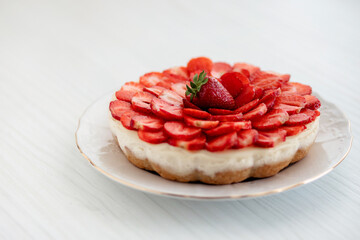 Strawberry Cheesecake on a white table.