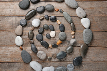 Beautiful spa composition with stones on wooden background. Zen concept