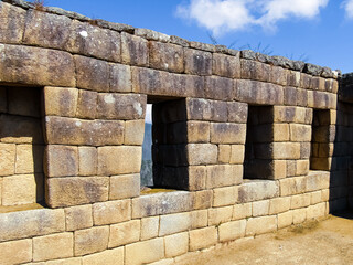Machu Picchu, Peru, is admired for its impressive architecture. Wall of an old ruined building. Perfect and geometric stone cuts.