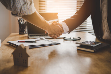 Agent client shaking hand signed contract deal transfer right property