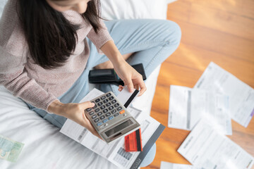 stressed woman calculating monthly expense andpayment bill invoice.