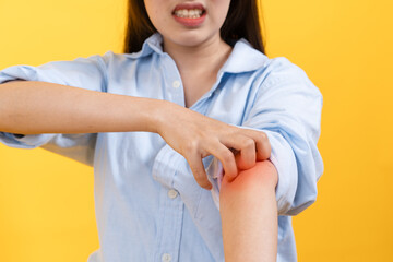 person itchy facial expression and hand scratch her arm skin