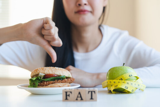 diet woman refuse eat junk food fat and choose green apple for fit