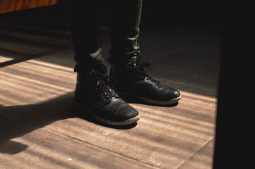 Fototapeta na wymiar men's shoes with brown background