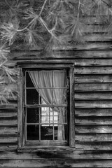 Old Windows on the side of Colonial era old and weathered structures in the Pine Barrens of New Jersey