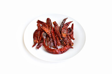 A plate of red dried chili on a white background.