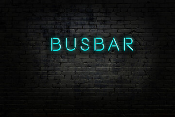 Neon sign with inscription busbar against brick wall