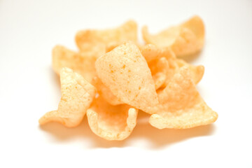 prawn crackers chips isolated on white background - homemade crunchy prawn crackers or shrimp crisp rice traditional snack