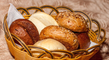 A basket filled with different kinds of buns