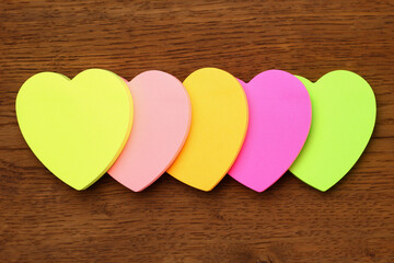 Five blank heart shaped stickers with space for text. Creative symbolic background