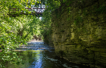 Bridge Over a River Surrounded by Limestone Walls