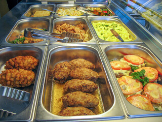 Trays with food in a Russian cuisine canteen