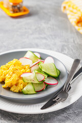 Scrambled  eggs with cucumber and radish