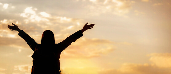 Freedom concept. Happy young woman enjoying freedom with open hands looking to the sky
