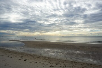 Cloudy sky in the morning after  low tide in Huahin Thailand