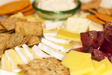 Cheese crackers and fruits background