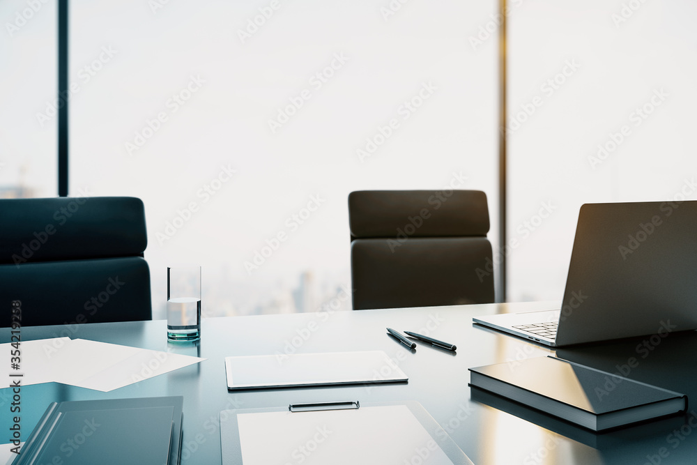 Aufkleber Modern laptop on the desktop against the background of a window with a city view. 3D Rendering