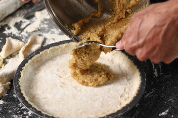Transfer honey filling into pastry case. Making Shoofly Tart Series.