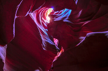 Beautiful view of amazing sandstone formations in famous Antelope Canyon on a sunny day with blue...