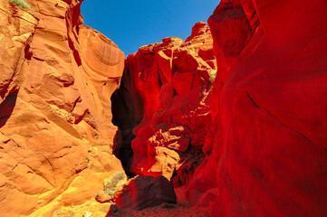 Beautiful view of amazing sandstone formations in famous Antelope Canyon on a sunny day with blue...