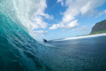 Kitesurfer rides on the waves of the Indian Ocean on the island of Mauritius