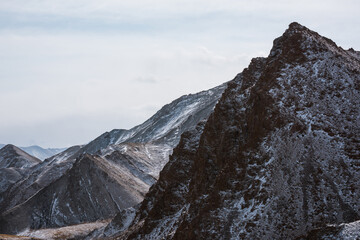 lanscape with barren mountain which is covered with ice
