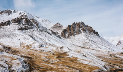 lanscape with barren mountain which is covered with ice