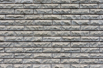 Fototapeta na wymiar Texture of gray brick wall