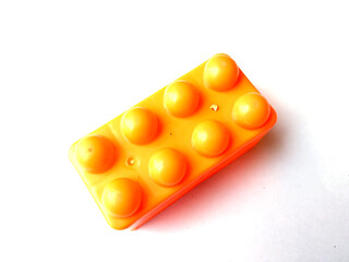 Top view on multi color toy bricks isolated on white  background