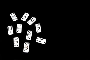 Dominoes on a black background.