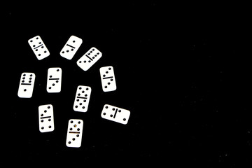 Dominoes on a black background.