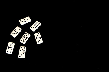 Dominoes on a black background.