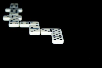 Dominoes on a black background.