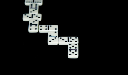 Dominoes on a black background.