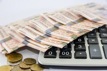500 hryvnia banknotes on a calculator, closeup. Business concept.