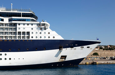 large blue and white cruise ship in the port of the historical city, side view, Rhodes island, Greece.