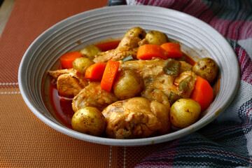 Freshly cooked Filipino food Chicken Afritada or chicken cooked in tomato sauce with potatoes and...