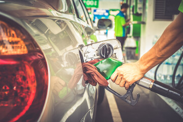 Car refueling fuel on petrol station. Man pumping gasoline oil. Service is filling gas or biodiesel...
