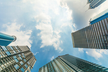 Ortigas, Metro Manila: Looking up at buildings and skyscrapers. Open sky in top corner of photo