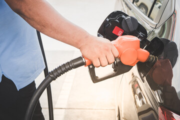 Car refueling fuel on petrol station. Man pumping gasoline oil. Service is filling gas or biodiesel...