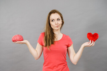 Woman choosing between love and mind