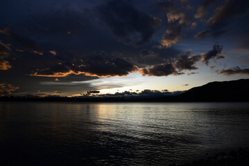 Naklejka na ściany i meble Sunset at lake tekapo shore